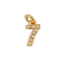 Macro view of gold number 7 pendant with micro-paved white zircon stones and ring - Number 7 / Gold