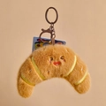 Porte-clés croissant en peluche avec visage souriant et texture douce et soyeuse - Croissant / 12cm