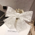Elegant white lace bow hair clip with 3D floral embroidery on a golden stand - Lace Embroidery Style / White Lace Bow Clip