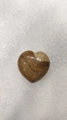 Polished heart-shaped jasper stone with brown and cream swirl textures on white background - Jasper