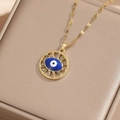 Golden evil eye necklace with colorful zircon pendant on premium jewelry box surface - Gold Colorful Zircon-Hollow Circular Eye
