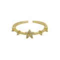 Golden 18K brass flower ring with cubic zirconia center and adjustable open band - November