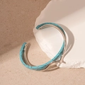 Detail shot of a double-layer open cuff bracelet with turquoise stone inlay on white stone - Light Blue Texture (Silver Edge)