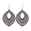 Macro view of dark brown teardrop wood earrings with intricate bohemian hollow patterns - #6 Teardrop Engraved Hollow Style