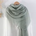 Sage green cotton linen scarf with pleated texture and tassel edge on hanger - Sage Green