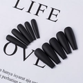 Flat lay of matte black coffin press-on nails displayed on a white background prop - Black