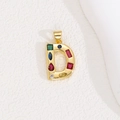 Detailed view of golden letter D pendant with colorful square and round zircon stones - Letter D