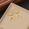 Minimalist double-layer moon pendant necklace in gold finish on a beige jewelry tray - Earrings