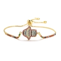 Adjustable golden Hamsa Hand bracelet with multi-color zircon stones on white background - Gold Hamsa Hand - Colorful Zirconia