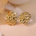 Macro detail of gold-plated woven texture earrings on a minimalist stone display - Gold Oval Plaid Texture (E0361)