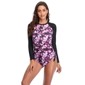 Detail of long sleeve swimsuit with purple floral print and black sleeves for surfing - S / Pink