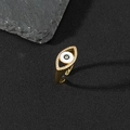 Macro shot of gold evil eye ring with blue enamel and sparkling pavé zircon stones - L-Oval Pavé Enamel Eye