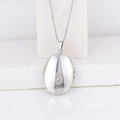 Oval silver stainless steel locket necklace with polished finish on a white stand - Oval Smooth 30*24/Steel