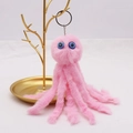 Pink plush octopus keychain with blue eyes and gold metal clip on white background - 18cm / Pink