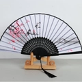 Japanese style folding fan with plum blossom ink painting and black hollowed bamboo frame - Black Ribs Pattern 40