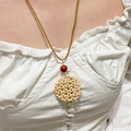 Close-up of a bohemian round pendant with cream wooden beads and a red accent bead - Red Bead White Wood Bead Disc Necklace (DZ-305)