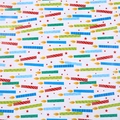 Birthday gift wrapping paper featuring colorful cartoon candles and red stars on white - Star Candles