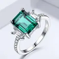 Classic 925 sterling silver ring featuring emerald-cut green gemstone with side stones - Size 5 / Emerald Cut Style (RUJ078E-1) / Green