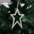 Golden glittery star ornament 16x11cm hanging on a green Christmas tree branch - Large Gold Hollow Star