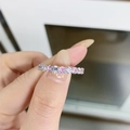 Detail of silver S925 ring featuring a row of alternating pink and white gemstones - US 6 / Pink & White
