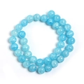Macro detail of sky blue round glass beads with a unique cracked texture for DIY jewelry - Lake Blue Floral Round Bead