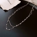 Double-layer silver necklace with snake chain and small white pearls on black background - Silver Necklace 3mm Pearl