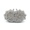 Macro shot of silver crystal rose evening clutch with sparkling rhinestones details - Silver