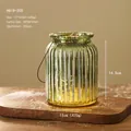 Vertical striped translucent olive green glass lantern with warm LED lights and wire handle - Green Vertical Ribbed Lantern Style (HG18-205)