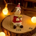 Miniature resin Christmas dog ornament in red hat holding sand hammers for desk decor - No.19 Christmas Dog with Maracas