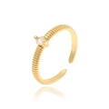 Close-up of golden textured adjustable ring featuring a sparkling round clear gemstone - Gold/White Zirconia