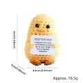 Detailed size view of yellow knitted crochet duck with positive energy card, 9cm height - Duck