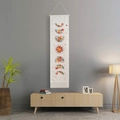 Bohemian floral moon phase tapestry with tassel detail hanging in a cozy living room scene - Floral Moon Phase-White