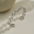Silver floral open cuff bangle featuring continuous five-petal flower patterns - Silver Textured Flower
