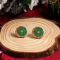 Festive green doughnut stud earrings with colorful sprinkles on a wooden tray - Donut