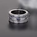 Macro shot of mechanical gear ring with blue stones and rows of pavé diamonds - Silver with Blue Stone