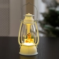 Close-up of a white Christmas lantern with deer scene and warm glowing LED light - Elk