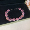Detail of pink oval gemstones set in a silver adjustable bracelet inside a green gift box - Silver Oval Pink Zirconia Bracelet (28#)