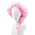 Detailed view of pink satin hair bonnet with wide elastic bands and long adjustable ribbons - Pink