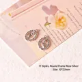 Detailed macro of vintage rose silver tulip charms for handmade earrings, 10x23mm - Style 11 Round Frame Rose Silver