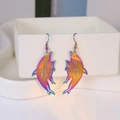 Macro detail of iridescent dolphin drop earrings with vibrant metallic rainbow gradient - Iridescent Dolphin