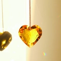 Golden heart-shaped faceted crystal suncatcher hanging with rainbow light effects - 45mm / Yellow