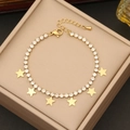 Elegante collar de estrellas doradas con pedrería clara en un joyero de color beige - 2# Pulsera