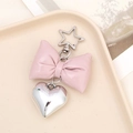 Pink faux leather bow keychain with silver heart charm and star-shaped metal clasp - Star Clasp Leather Bow / Pink