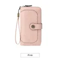 Pink RFID blocking long purse for women featuring laser-cut patterns and wrist strap - Pink