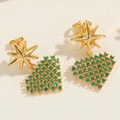 Macro shot of gold octagonal star and green zircon heart earrings on textured background - Green Heart (ES2308-3)
