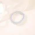 Detailed close-up of metallic silver spiral hair ties against a soft silk backdrop - Metallic Silver (5cm Thick)