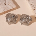 Detailed macro view of 3D rose flower earrings in silver metal with textured petals - Silver Rose Stud Earrings / Silver