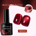 Detail of red cat eye nail gel bottle with swatches and brush applicator texture - Crimson Cat Eye MY10