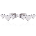 Close-up of silver triple heart stud earrings with polished mirror finish and reflections - Steel