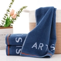 Dark blue cotton towel featuring white 'ARTS' embroidery and orange border accents - ART Style Blue Towel